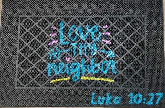 Doormat with 'Love your neighbor' text and Bible verse on a textured surface